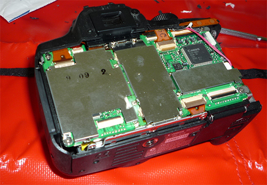Circuit board and shields installed in camera.